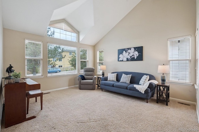 6534 S Union Way, Littleton, CO 80127 - carpeted living area with high vaulted ceiling and plenty of natural light