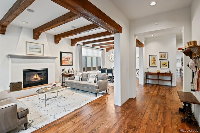 458 Adams St, Denver, CO 80206 - living area featuring hardwood / wood-style floors, a glass covered fireplace, beamed ceiling, and recessed lighting