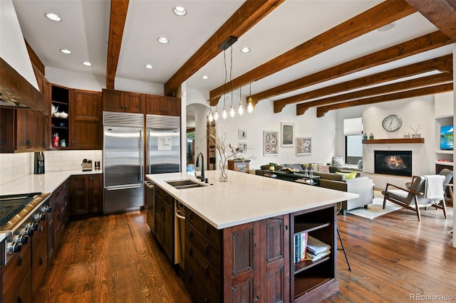 458 Adams St, Denver, CO 80206 - kitchen featuring open shelves, a sink, beam ceiling, stainless steel appliances, and dark wood finished floors