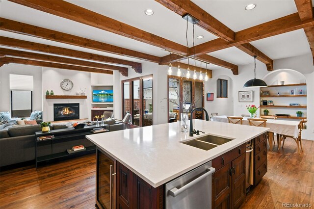 458 Adams St, Denver, CO 80206 - kitchen featuring a sink, dishwasher, open floor plan, dark wood-style floors, and beam ceiling