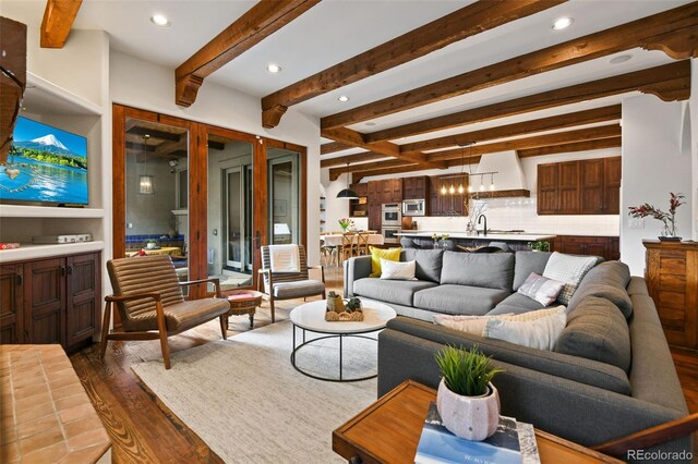 458 Adams St, Denver, CO 80206 - living room with dark wood-style flooring, beam ceiling, and recessed lighting