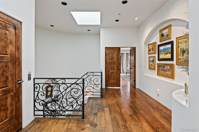 458 Adams St, Denver, CO 80206 - hall featuring a skylight, an upstairs landing, wood finished floors, and recessed lighting