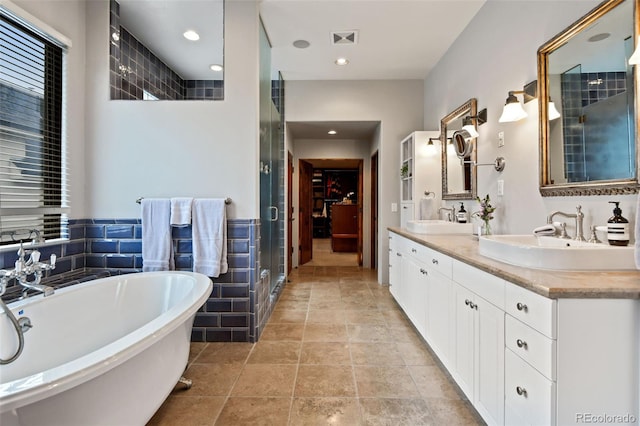 458 Adams St, Denver, CO 80206 - full bath featuring a freestanding bath, double vanity, a stall shower, and recessed lighting