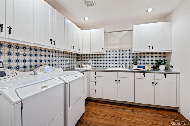 458 Adams St, Denver, CO 80206 - laundry room with washing machine and clothes dryer, dark wood-style flooring, recessed lighting, and cabinet space