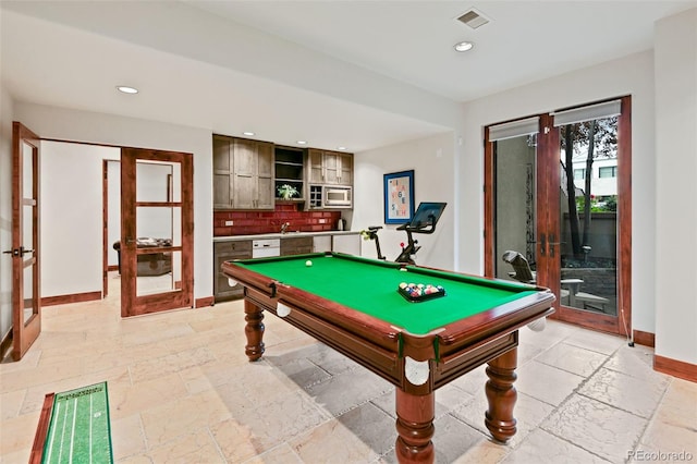 458 Adams St, Denver, CO 80206 - playroom featuring french doors, baseboards, stone tile flooring, a sink, and recessed lighting