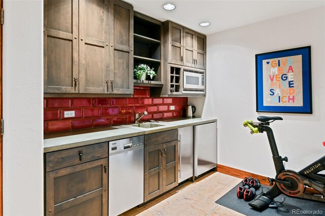 458 Adams St, Denver, CO 80206 - kitchen featuring dishwashing machine, a sink, white microwave, tasteful backsplash, and open shelves
