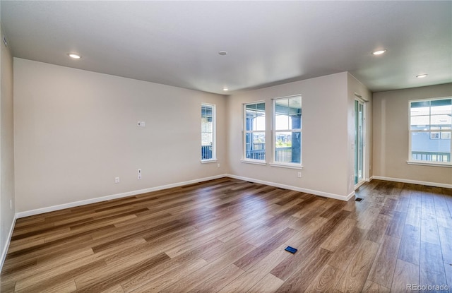 spare room featuring hardwood / wood-style flooring