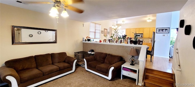 living room featuring ceiling fan, plenty of natural light, and hardwood / wood-style floors