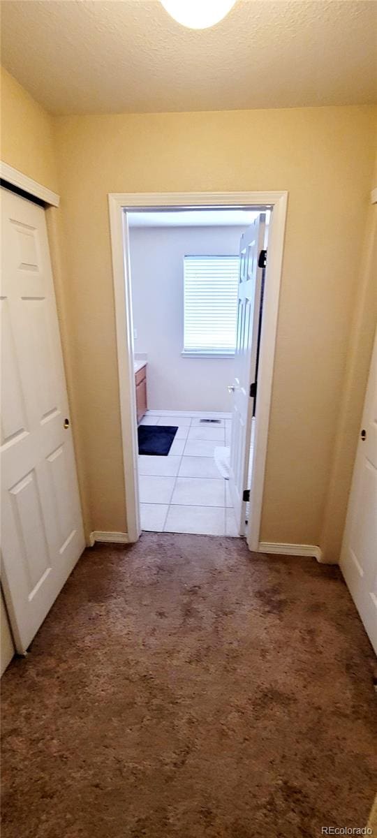 hallway featuring carpet floors