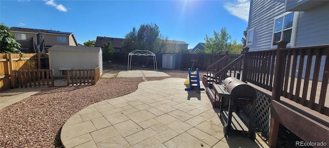 view of patio featuring a shed