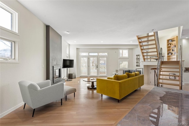 living room featuring light hardwood / wood-style flooring and a wealth of natural light