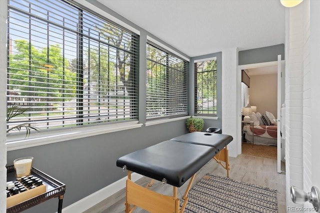 534 E 7th Ave Unit 101, Denver, CO 80203 - game room featuring wood finished floors and baseboards