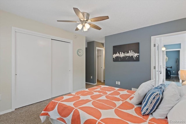 534 E 7th Ave Unit 101, Denver, CO 80203 - bedroom featuring a closet, a ceiling fan, and baseboards