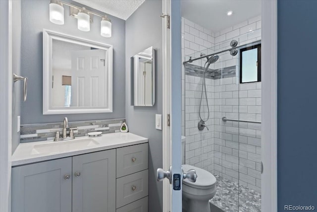 534 E 7th Ave Unit 101, Denver, CO 80203 - full bathroom featuring a shower stall, toilet, and vanity