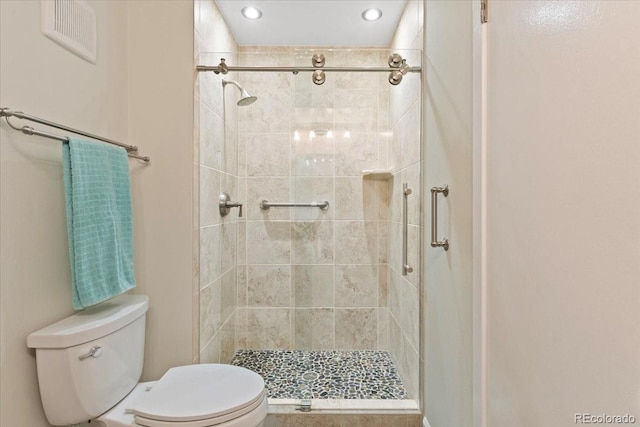 534 E 7th Ave Unit 101, Denver, CO 80203 - bathroom featuring toilet, a stall shower, and recessed lighting