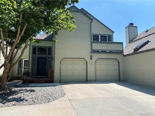5479 E Weaver Ave, Centennial, CO 80121 - view of front of house featuring driveway and an attached garage