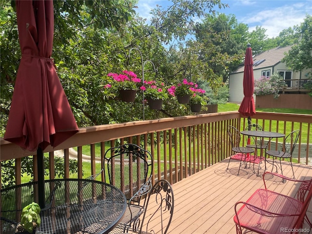 5479 E Weaver Ave, Centennial, CO 80121 - wooden terrace with outdoor dining space and a lawn