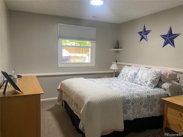 5479 E Weaver Ave, Centennial, CO 80121 - carpeted bedroom with a textured ceiling
