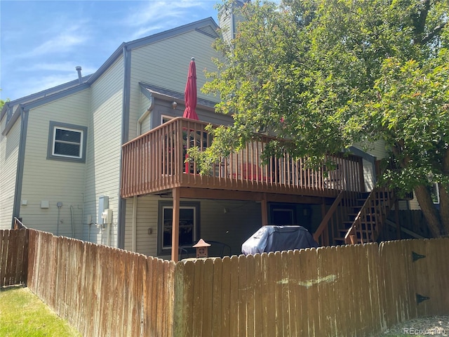 5479 E Weaver Ave, Centennial, CO 80121 - rear view of property with a wooden deck and stairs
