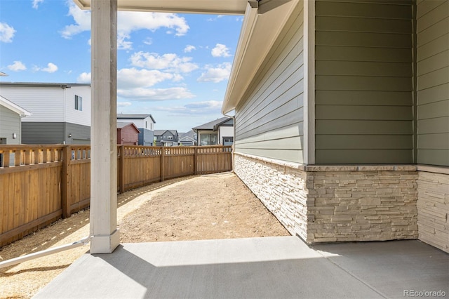 21034 E 63rd Dr, Aurora, CO 80019 - fenced backyard featuring a patio area and a residential view