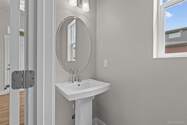 21034 E 63rd Dr, Aurora, CO 80019 - bathroom with wood finished floors and a sink