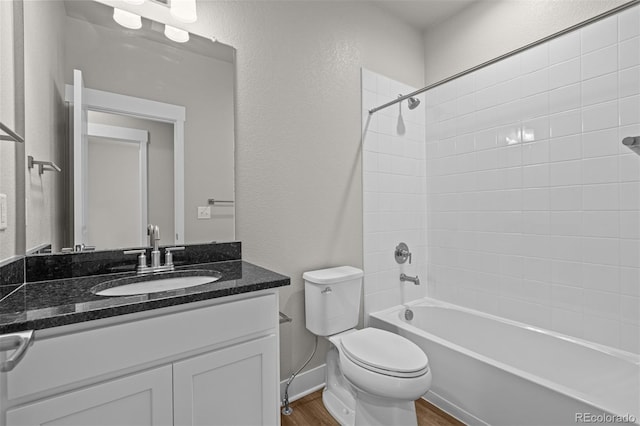 21034 E 63rd Dr, Aurora, CO 80019 - full bath featuring wood finished floors, vanity, shower / tub combination, and a textured wall