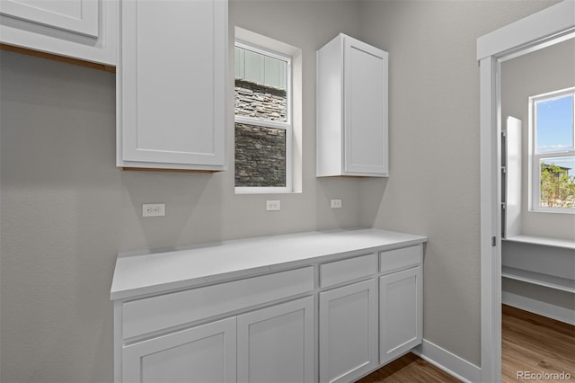 21034 E 63rd Dr, Aurora, CO 80019 - detailed view of wood finished floors and baseboards
