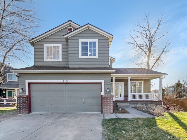 view of front property with a porch and a garage