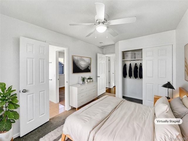 bedroom featuring ceiling fan and a closet