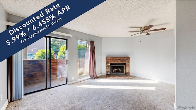 12360 W Nevada Pl Unit 101, Lakewood, CO 80228 - unfurnished living room with a textured ceiling, ceiling fan, carpet floors, and a fireplace