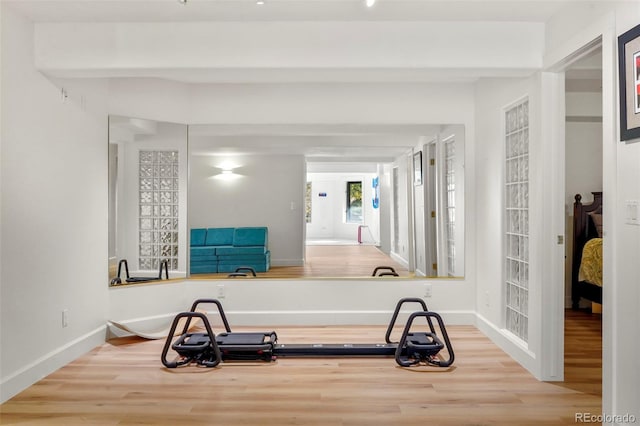 exercise area with hardwood / wood-style flooring