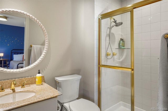 bathroom featuring vanity, walk in shower, and toilet