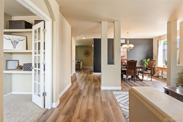 2192 Paint Pony Cir, Castle Rock, CO 80108 - entryway featuring wood finished floors and a chandelier