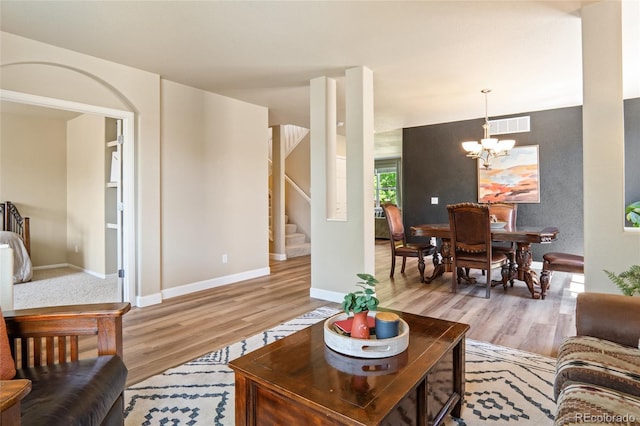 2192 Paint Pony Cir, Castle Rock, CO 80108 - living area with light wood-style floors, stairway, and a chandelier