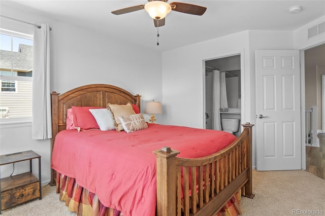 2192 Paint Pony Cir, Castle Rock, CO 80108 - carpeted bedroom with ceiling fan and connected bathroom