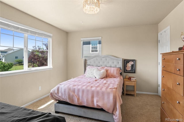 2192 Paint Pony Cir, Castle Rock, CO 80108 - carpeted bedroom with baseboards and a chandelier