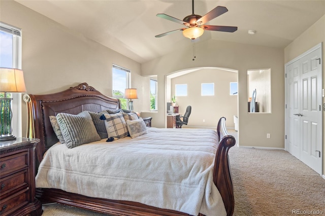 2192 Paint Pony Cir, Castle Rock, CO 80108 - bedroom with carpet flooring, multiple windows, vaulted ceiling, and ceiling fan