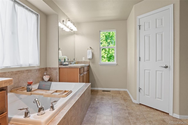 2192 Paint Pony Cir, Castle Rock, CO 80108 - full bath featuring vanity, a garden tub, and tile patterned floors