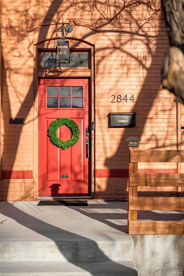 entrance to property with brick siding