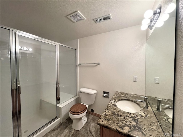 full bathroom with toilet, a shower stall, visible vents, and a textured ceiling