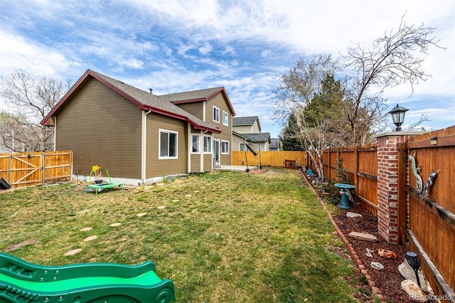 view of yard with a fenced backyard