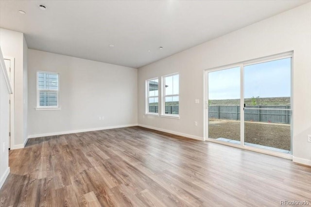 19018 E 94th Pl, Commerce City, CO 80022 - unfurnished room featuring wood finished floors and baseboards