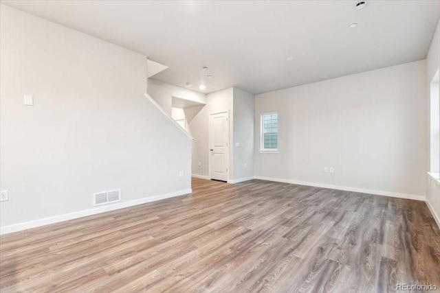 19018 E 94th Pl, Commerce City, CO 80022 - unfurnished room featuring wood finished floors, baseboards, and recessed lighting