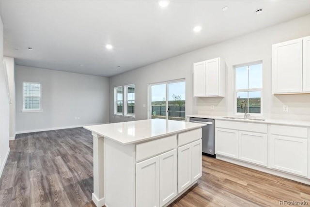 19018 E 94th Pl, Commerce City, CO 80022 - kitchen with stainless steel dishwasher, a sink, a center island, light countertops, and recessed lighting