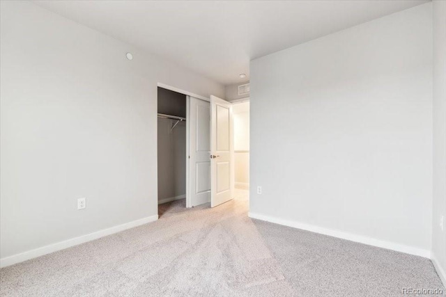 19018 E 94th Pl, Commerce City, CO 80022 - unfurnished bedroom featuring light carpet, baseboards, and a closet