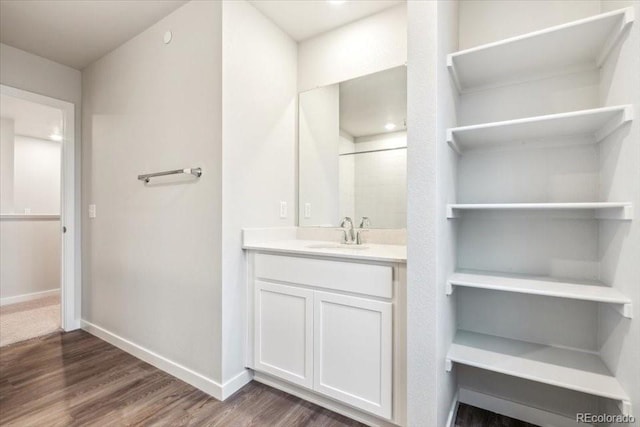 19018 E 94th Pl, Commerce City, CO 80022 - full bathroom featuring wood finished floors, vanity, and baseboards