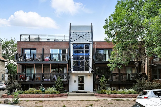 1045 N Clarkson St Unit 102, Denver, CO 80218 - view of front of property with brick siding