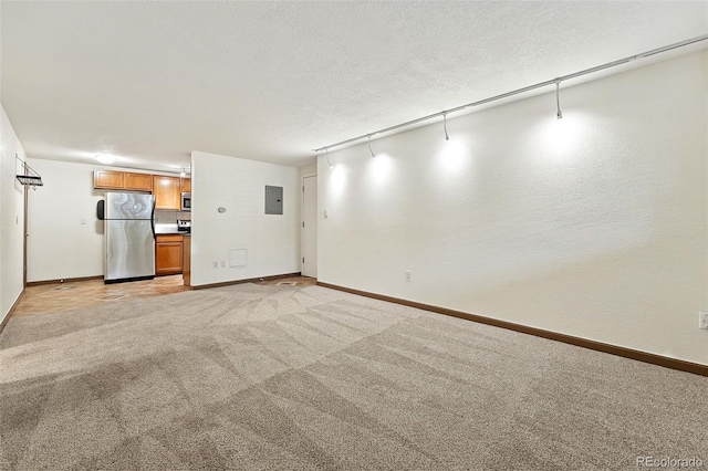 1045 N Clarkson St Unit 102, Denver, CO 80218 - unfurnished living room featuring electric panel and light carpet