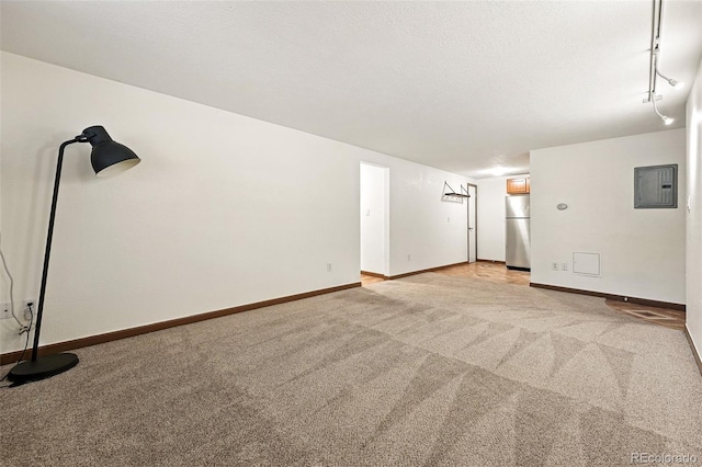 1045 N Clarkson St Unit 102, Denver, CO 80218 - spare room featuring electric panel and light carpet