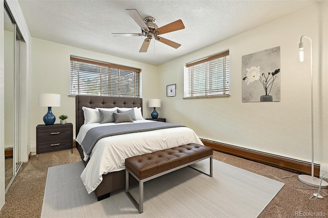 1045 N Clarkson St Unit 102, Denver, CO 80218 - carpeted bedroom featuring baseboard heating, ceiling fan, and a textured ceiling